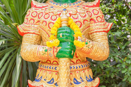 Single giant statue closed up view to its hands and club, Thailandの写真素材