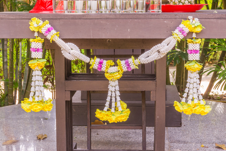 Flowers decoration at Thai spirit houseの写真素材