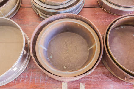 Old metal sieves for mining workの写真素材