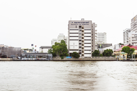 Bangkok, Thailand - June 5, 2016: The faculty of Nursing, Mahidol university view from the other side of Chao Phraya River on cloudy dayのeditorial素材