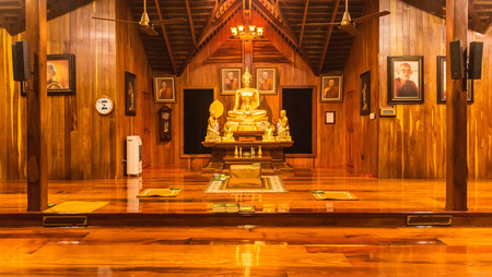 Mahasarakham, Thailand - Aug 20, 2016: Buddha statue in wooden church at Thai templeのeditorial素材