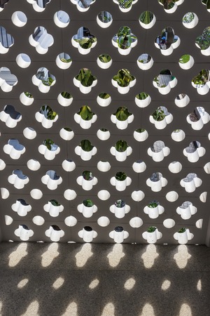 Hollow old style concrete block wall with Sino-Portuguese style for decorationの写真素材