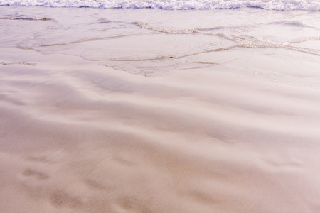 Closed up beach rim with very fine sand backgroundの写真素材