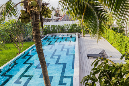 Phuket, Thailand - April 19, 2017: The swimming pool of the Little Nyonya Hotel, the beautiful Sino-Portuguese style hotel. It is the unique destination for many tourists.のeditorial素材