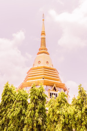 The beautiful pagoda at Naka temple with twilight cloud background, Phuket, Thailandの写真素材