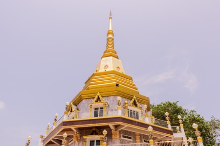 The beautiful pagoda at Naka temple with twilight cloud background, Phuket, Thailandの写真素材