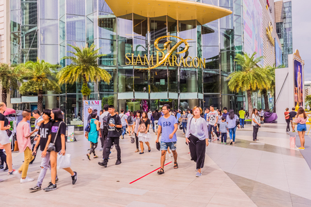 Bangkok, Thailand - July 8, 2017: Crowd of people is walking in front of "Siam Paragon" the world-class shopping center of Thailand. It is the well-known destination for tourists over the world.のeditorial素材