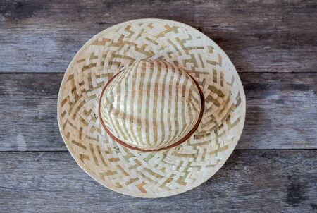 Straw hat on wooden background