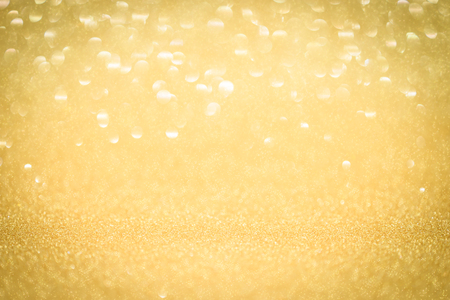 Abstract christmas and new year gold blinking background.の写真素材
