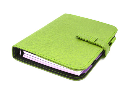 Green leather business diary isolated on white backgroundの写真素材