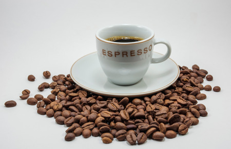 cup of coffee on coffee grainsの写真素材