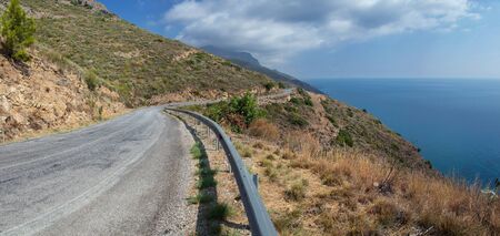 Scenic Country Road in Turkey, winding over Mediterranean Seaの写真素材