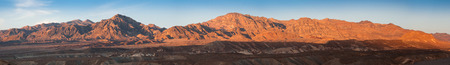 Panoramic view at hills lighted by sunset light in Death Valley, California, USAの写真素材