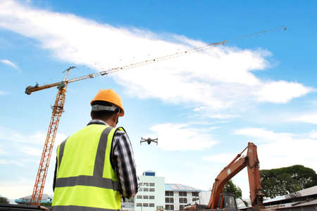 Construction Work Inspection Drone Supervisor Construction Site Inspection by Civil Engineers Using Dronesの写真素材