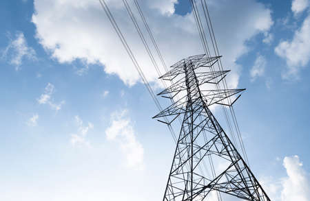 silhouette, high voltage tower and bright skyの写真素材