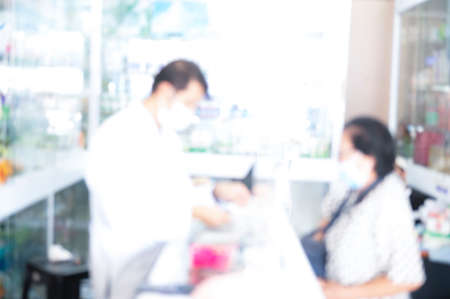 counter store table pharmacy background shelf blurred blur focus drug medical shop drugstore medication blank medicine pharmaceutics conceptの写真素材