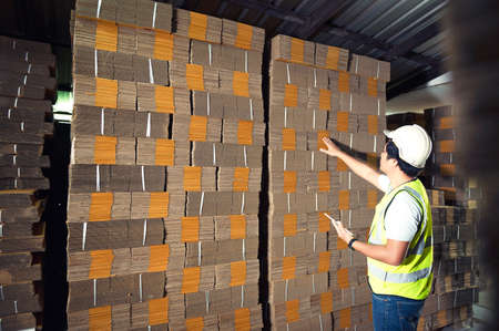 Warehouse workers checking stock in a large warehouse in a large warehouse.の写真素材