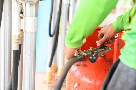 Bunch of LPG gas cylinders for kitchen cooking to be delivered to customers in local marketの写真素材