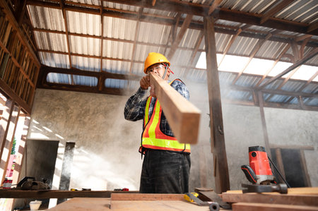 Carpenter working in an Asian carpentry office working portrait of a white man.