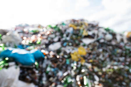 blurry image of garbage pile which covers the ecosystem of forests and fields Toxic to soil and waterの写真素材