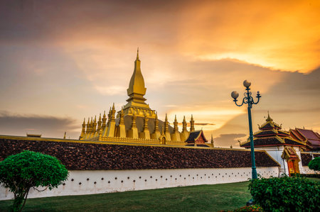 Laos Travel Landmark, Golden Chedi, Wat Phra That Luang at sunset in Vientianeの写真素材