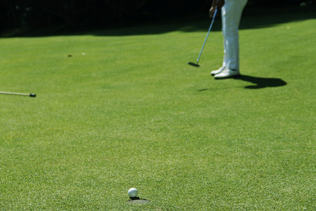 Golfer playing golf in beautiful golf course in the evening golf course with sunshine in thailand