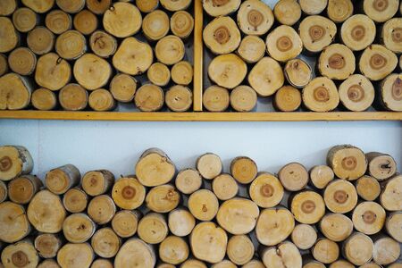 Abstract photo of a pile of natural wooden logsの写真素材