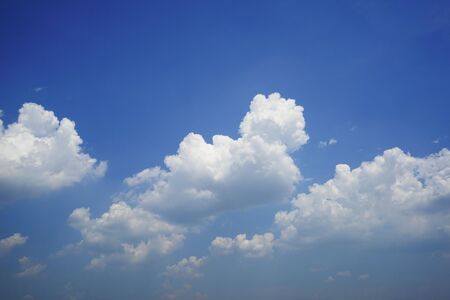 Blue sky with white clouds. Sky and clouds during the daytime in the summer. white fluffy clouds in the blue sky.                                    の写真素材