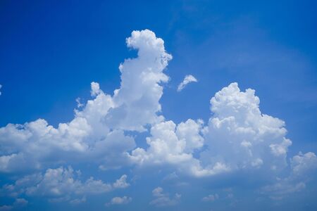 Blue sky with white clouds. Sky and clouds during the daytime in the summer. white fluffy clouds in the blue sky.                                    の写真素材