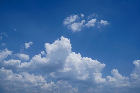Beautiful blue sky with cloud. Color sky is clear with white clouds on natural background. White fluffy cloudy abstract background.                                 の写真素材