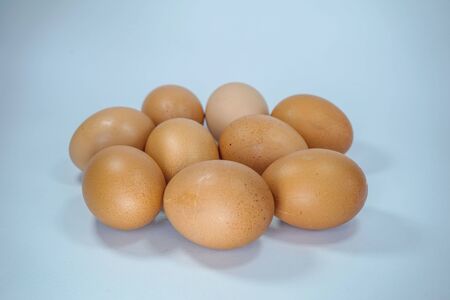 Group of brown Fresh eggs on a white background                               の写真素材