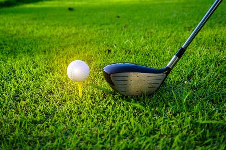 Golf balls on the golf course with golf clubs ready for golf in the first short. In the morning, with the beautiful sunlight.Sports that people around the world play in the holidays. の写真素材