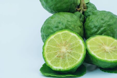 Fresh bergamot fruit with leaf and cut in half of bergamot on white background.                                の写真素材