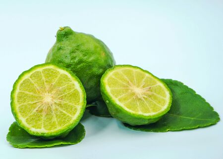 Fresh bergamot fruit with leaf and cut in half of bergamot on white background.                                の写真素材