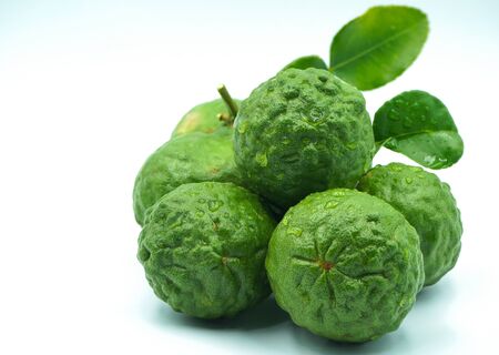 Fresh bergamot fruit with leaf and cut in half of bergamot on white background.                                の写真素材