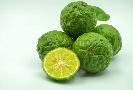 Fresh bergamot fruit with leaf and cut in half of bergamot on white background.                                の写真素材