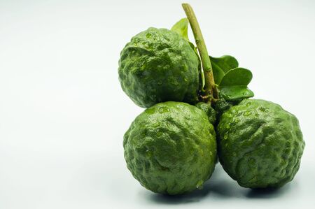 Fresh bergamot fruit with leaf and cut in half of bergamot on white background.                               の写真素材