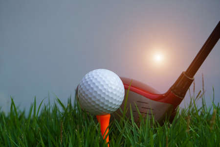 Golf balls on the golf course with golf clubs ready for golf in the first short. In the morning, with the beautiful sunlight.Sports that people around the world play in the holidays.の写真素材