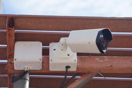 Dirty CCTV cameras are installed on the eaves for detecting property theft. CCTV security camera outdoors.の写真素材