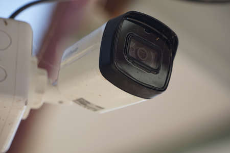 Dirty CCTV cameras are installed on the eaves for detecting property theft. CCTV security camera outdoors.の写真素材