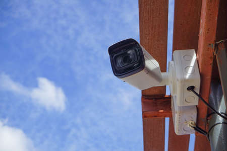 Dirty CCTV cameras are installed on the eaves for detecting property theft. CCTV security camera outdoors.の写真素材