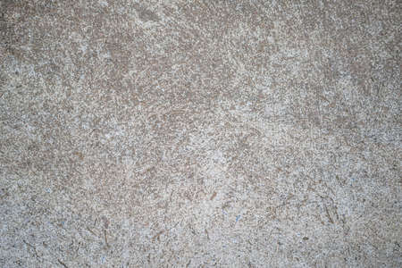 Cement wall background, not painted in vintage style for graphic design or retro wallpaper. Concrete walls with abstract patterns.Old cement texture in vintage style for graphic design or retro wallpaperの写真素材