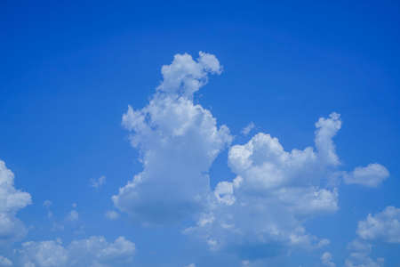 blue sky background with clouds. Beautiful white clouds against the blue sky.の写真素材