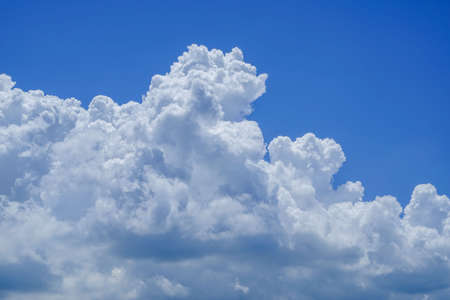 blue sky background with clouds. Beautiful white clouds against the blue sky.の写真素材