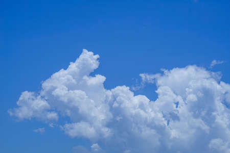 blue sky background with clouds. Beautiful white clouds against the blue sky.の写真素材