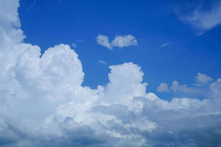 blue sky background with clouds. Beautiful white clouds against the blue sky.の写真素材