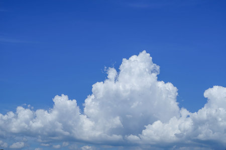 blue sky background with clouds. Beautiful white clouds against the blue sky.の写真素材