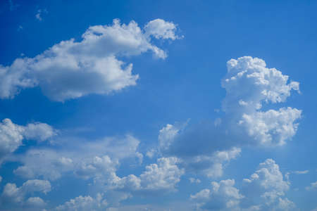 blue sky background with clouds. Beautiful white clouds against the blue sky.の写真素材