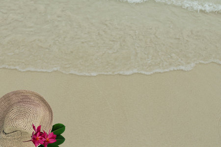 top view sand summer background with copy space. Summer background with copy space with visible sand texture and exotic accessories.の写真素材