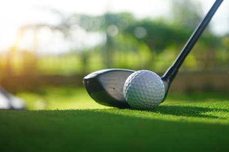 Golf balls on the golf course with golf clubs ready for golf in the first short. In the morning, with the beautiful sunlight.の写真素材